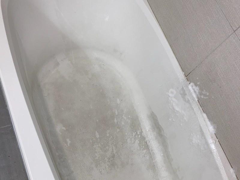 Before — Stained bathtub