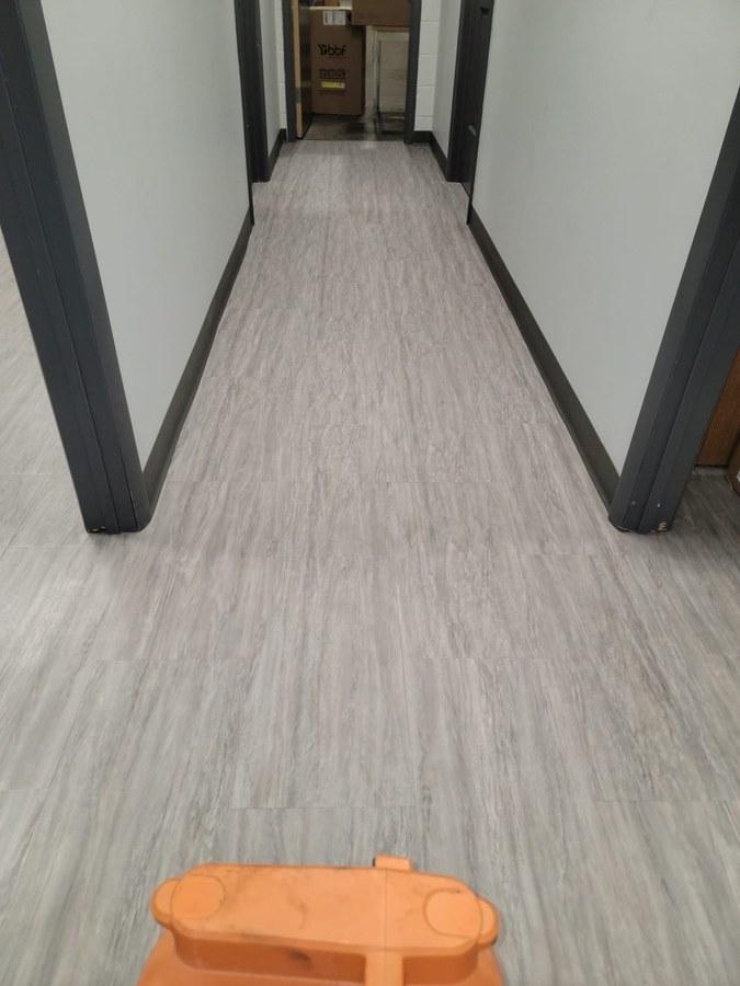 Before — Dirty LVP hallway floor